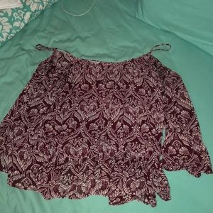 A maroon off the shoulder top